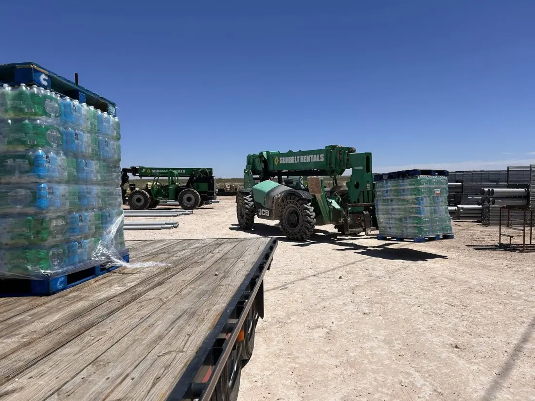 Loading water pallets at the yard